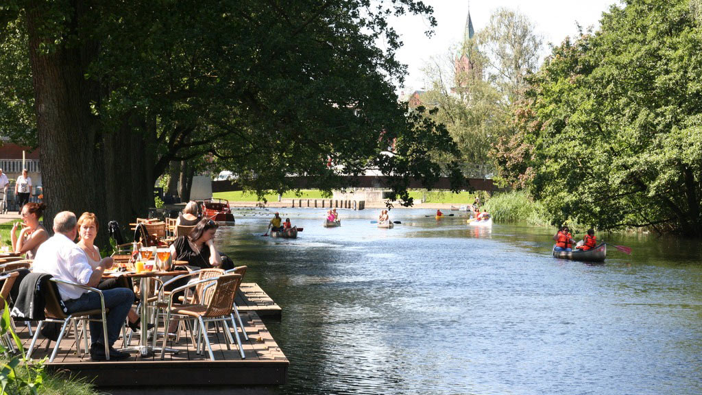 Cosiness at a café along the Gudenå River in the Lake District