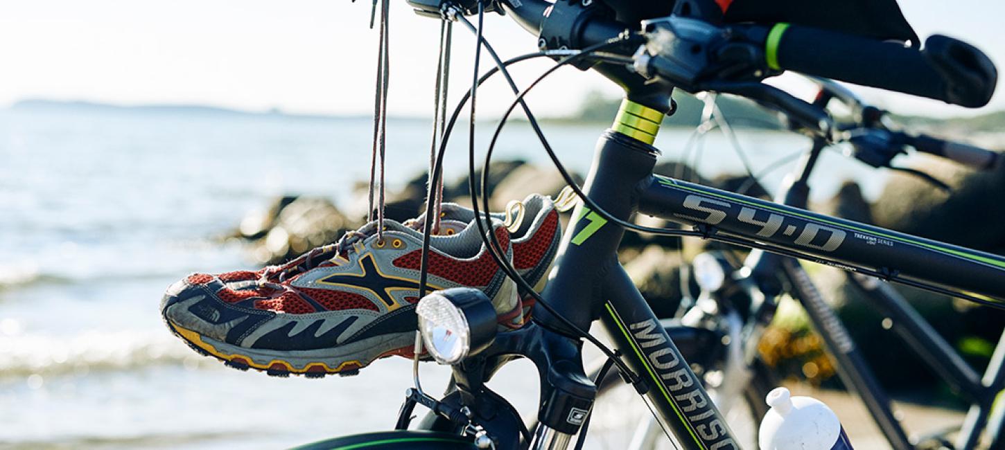 Bike with map and running shoes