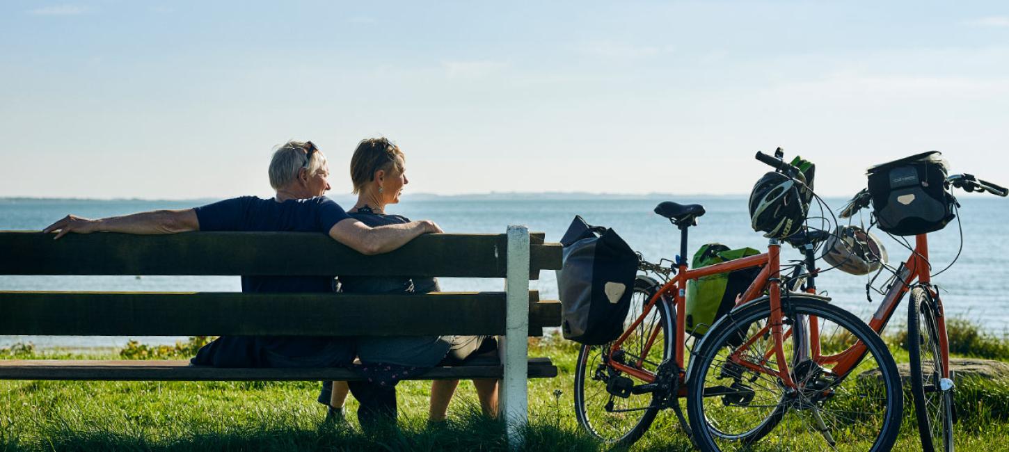 Couple on a bike trip on Djursland in Denmark