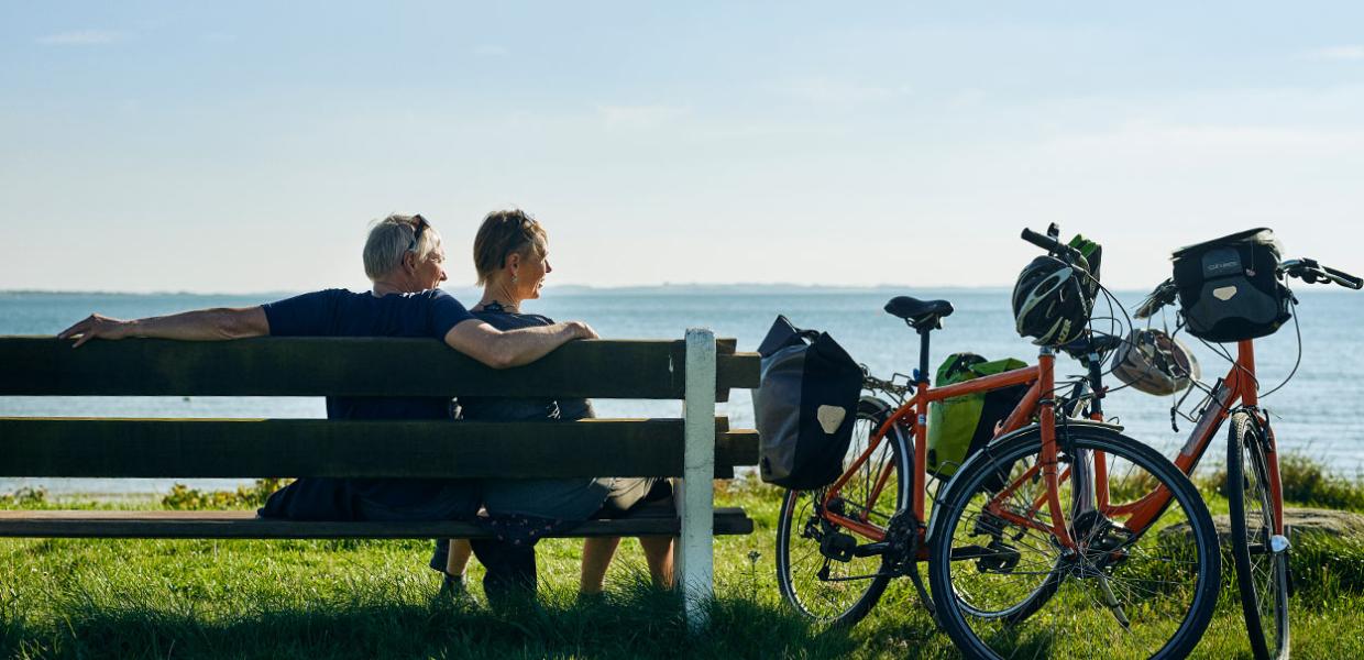 Couple on a bike trip on Djursland in Denmark