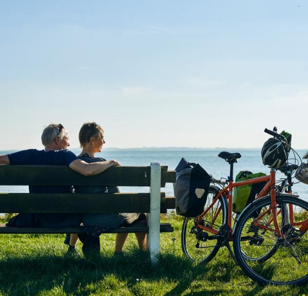 Couple on a bike trip on Djursland in Denmark