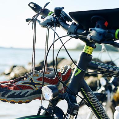 Bike with map and running shoes